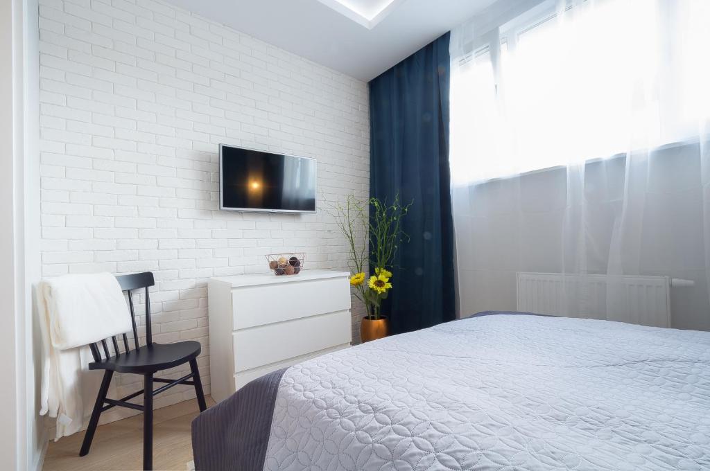 Posteľ alebo postele v izbe v ubytovaní Rajska Apartament- Gdańsk