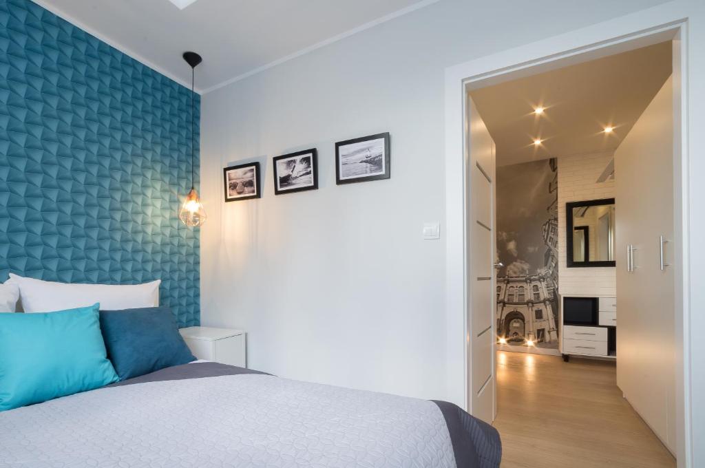 Posteľ alebo postele v izbe v ubytovaní Rajska Apartament- Gdańsk
