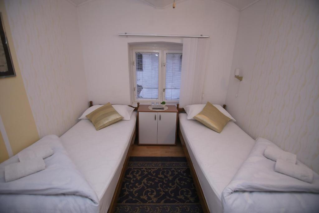 Postel nebo postele na pokoji v ubytování Guesthouse Kod Keme