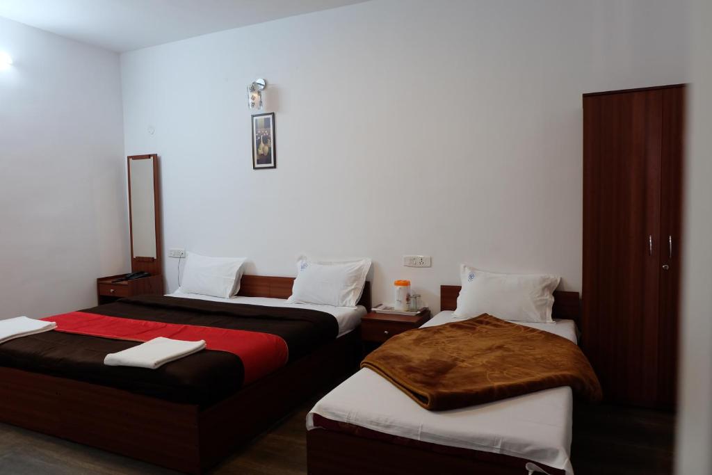 Postel nebo postele na pokoji v ubytování Rosepark Residency