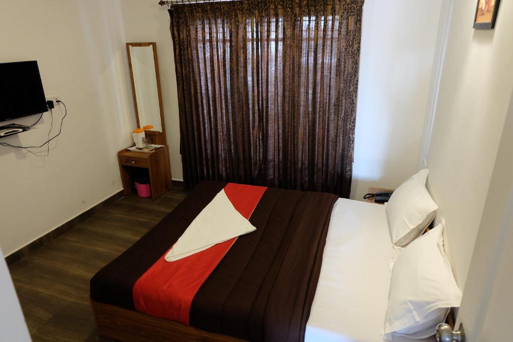 Postel nebo postele na pokoji v ubytování Rosepark Residency