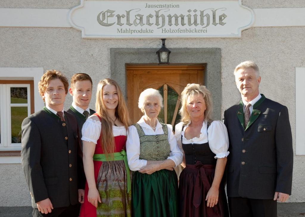 a group of people standing in front of a building at Erlachmühle in Mondsee