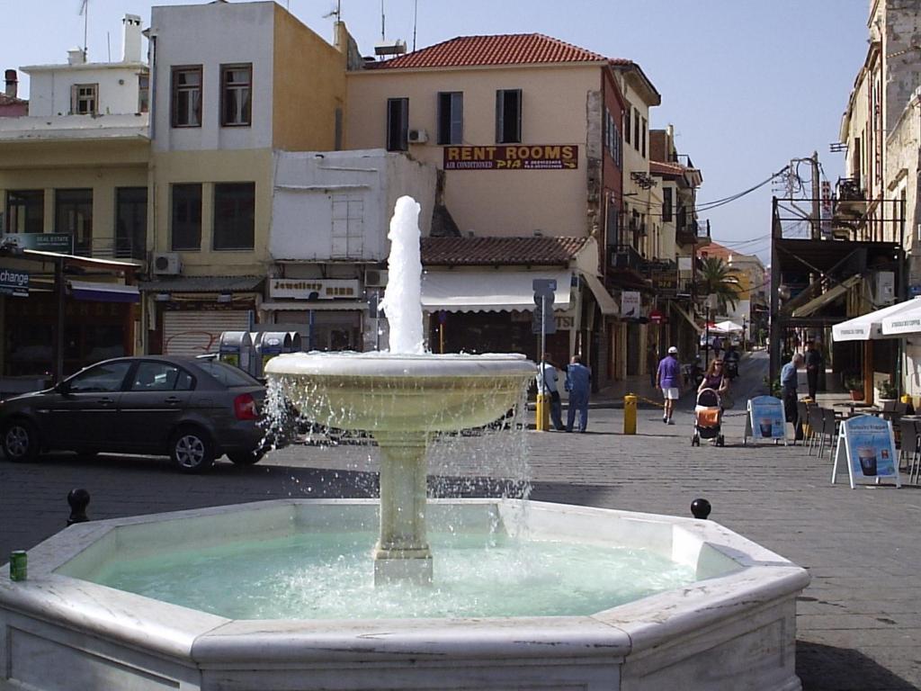 a water fountain in the middle of a street at Pia Rooms in Chania