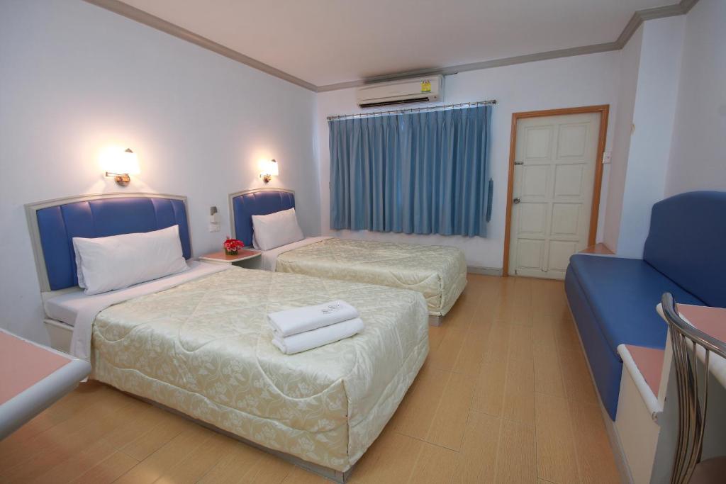Postel nebo postele na pokoji v ubytování P.A. Place Hotel