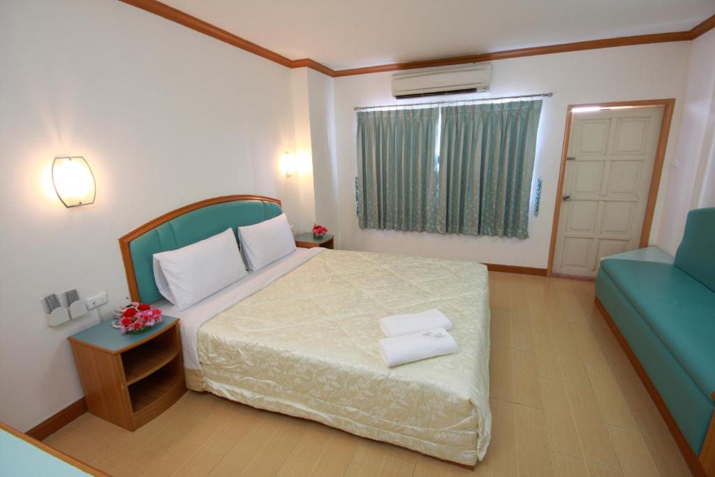 Postel nebo postele na pokoji v ubytování P.A. Place Hotel