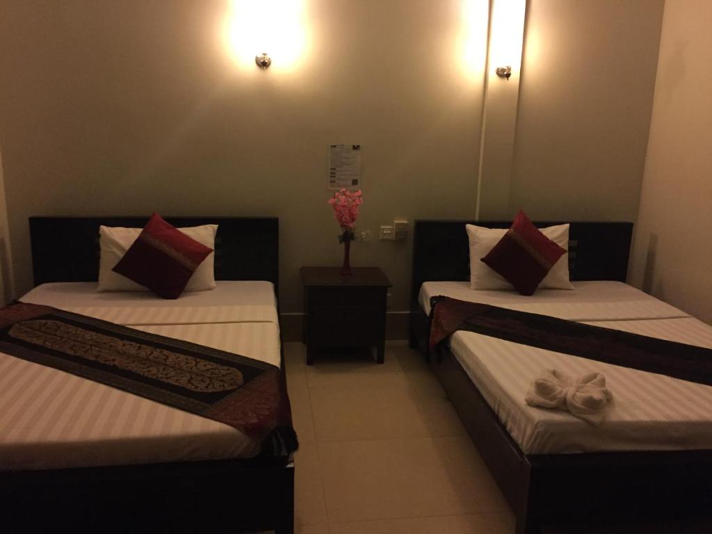 Postel nebo postele na pokoji v ubytování IKI IKI Guesthouse