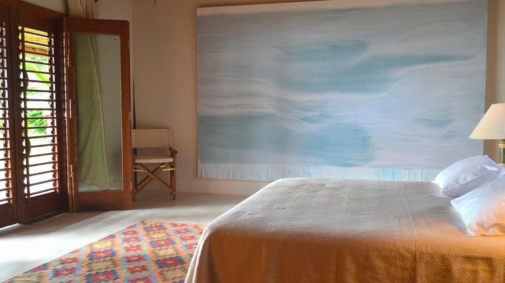 Postel nebo postele na pokoji v ubytování Camauí Hotel