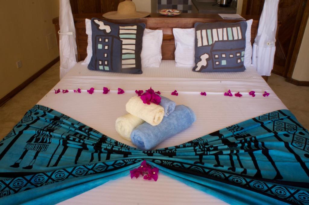 Postel nebo postele na pokoji v ubytování Zanziblue Boutique Villas
