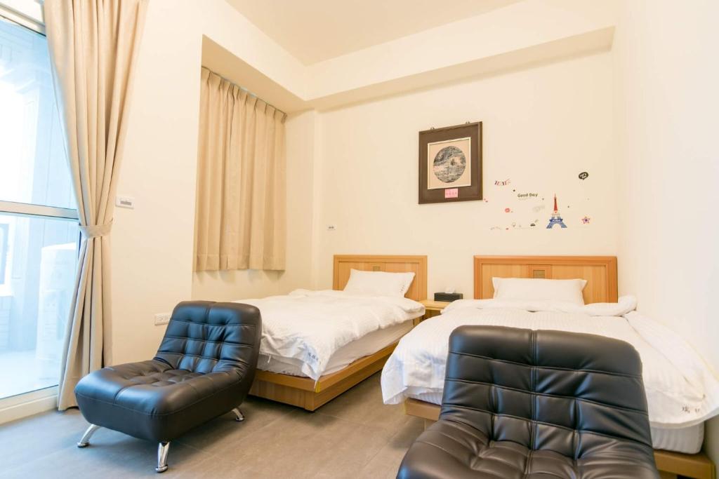 Postel nebo postele na pokoji v ubytování Ruisui Style B&B