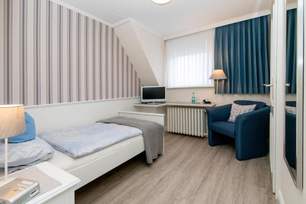 TV a/nebo společenská místnost v ubytování Hotel Berlin