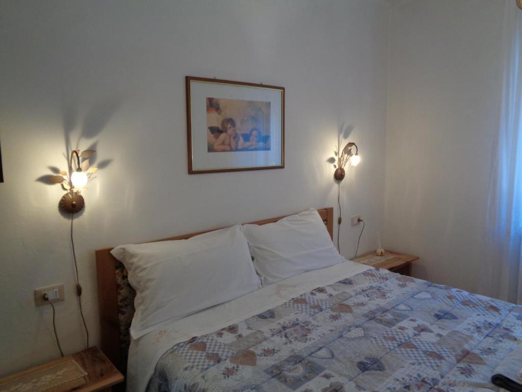 Postel nebo postele na pokoji v ubytování Casa Noemi Imer