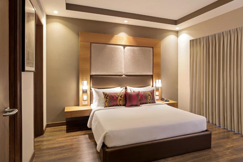 Postel nebo postele na pokoji v ubytování Lemon Tree Hotel, Sector 68, Sohna Road, Gurugram