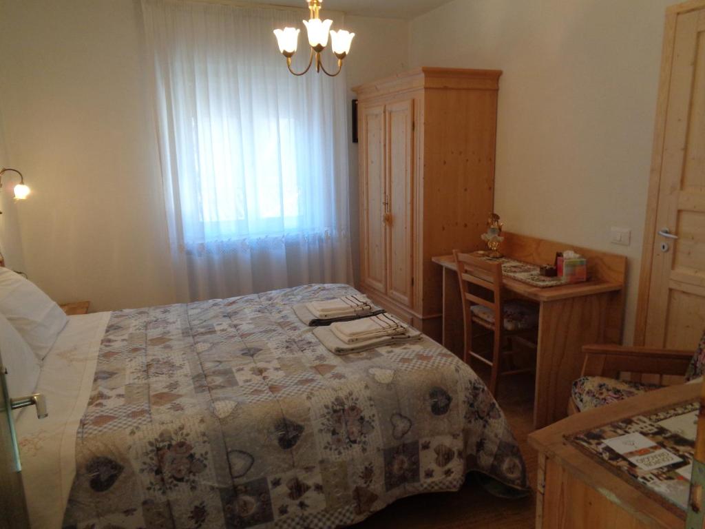 Postel nebo postele na pokoji v ubytování Casa Noemi Imer