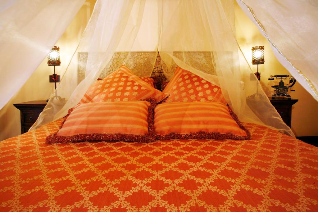 Posteľ alebo postele v izbe v ubytovaní Hotel Boutique Real Casona De Las Amas