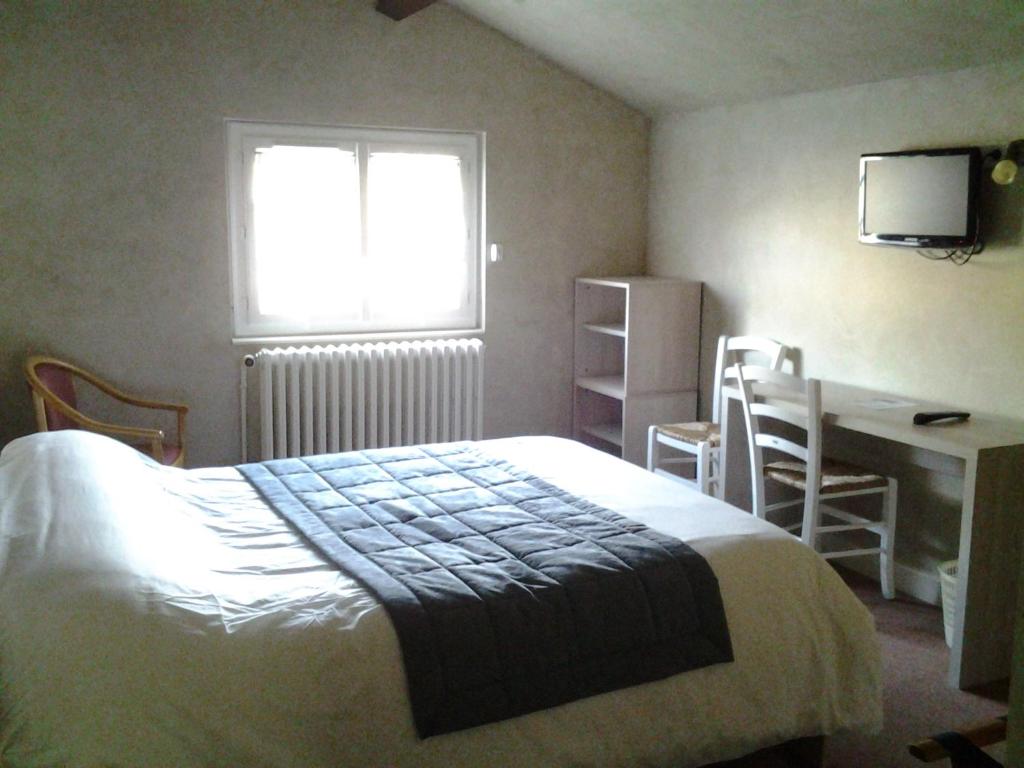 Postel nebo postele na pokoji v ubytování La Cremaillere