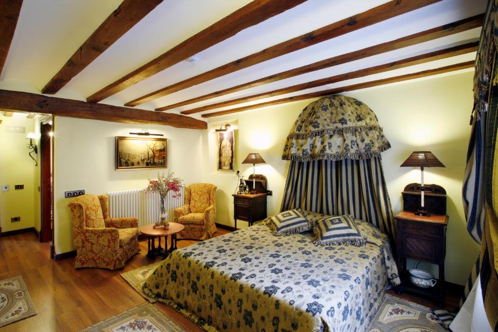Posteľ alebo postele v izbe v ubytovaní Hotel Boutique Real Casona De Las Amas
