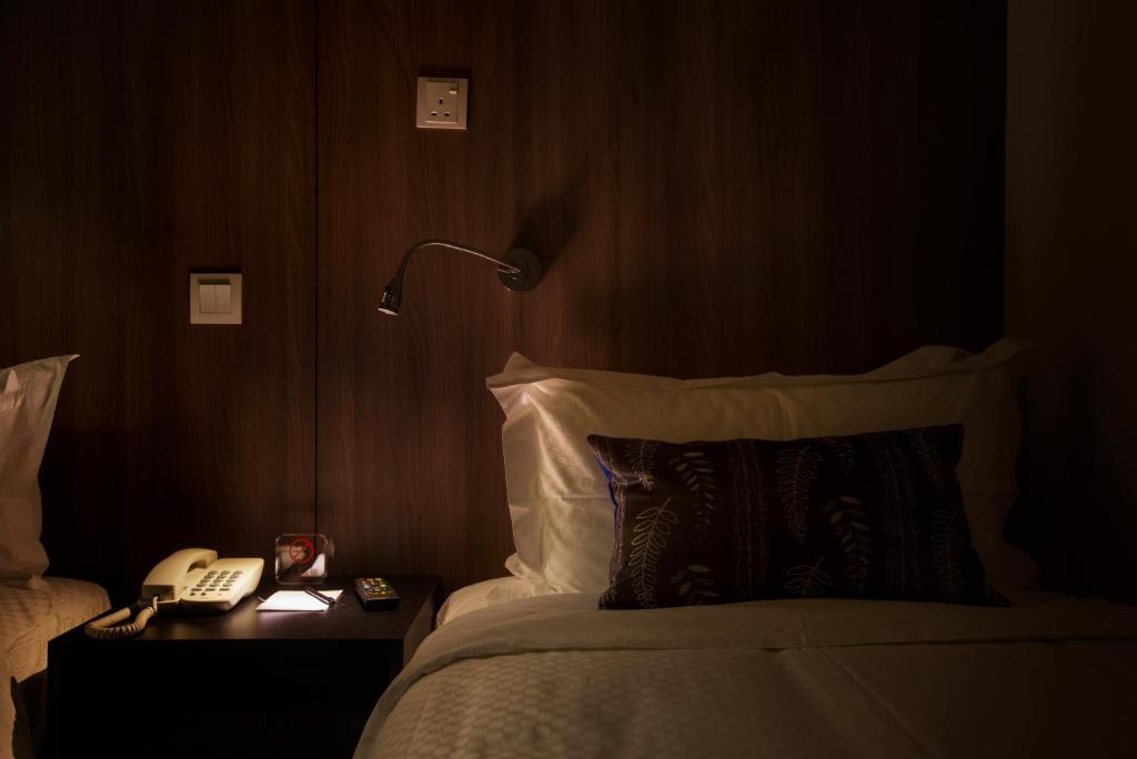Postel nebo postele na pokoji v ubytování Hotel Twenty 8B