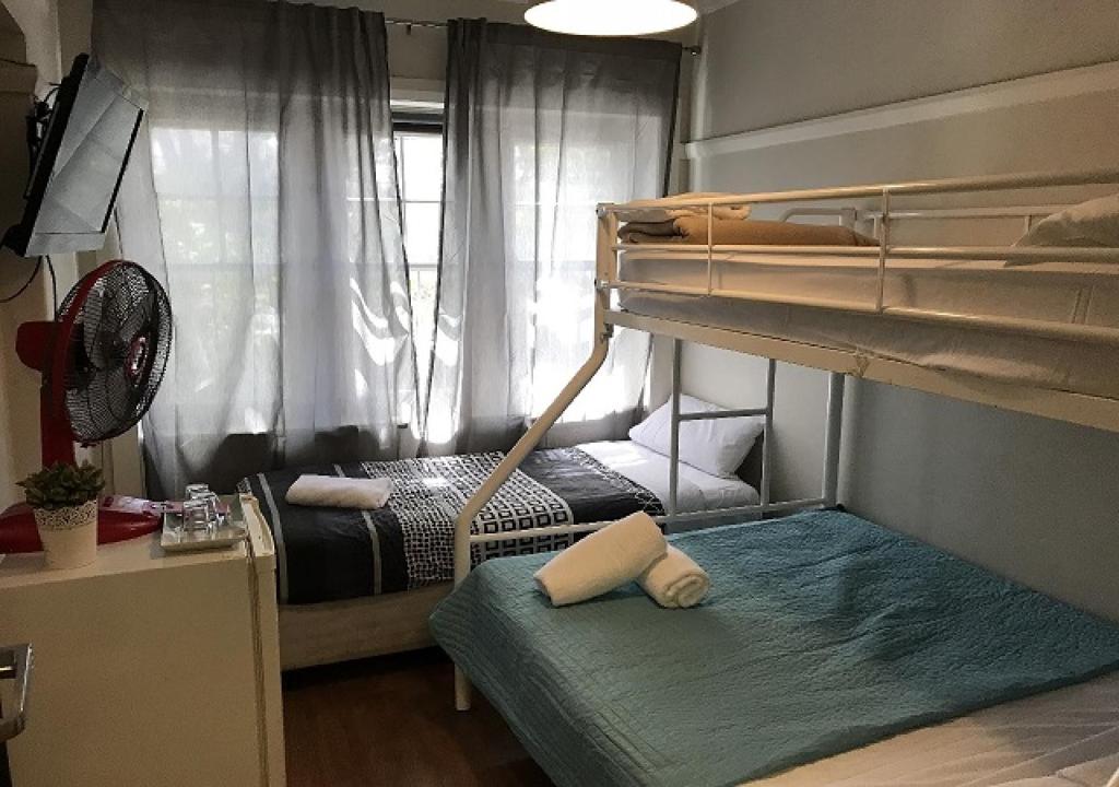 Postel nebo postele na pokoji v ubytování Highfield Private Hotel