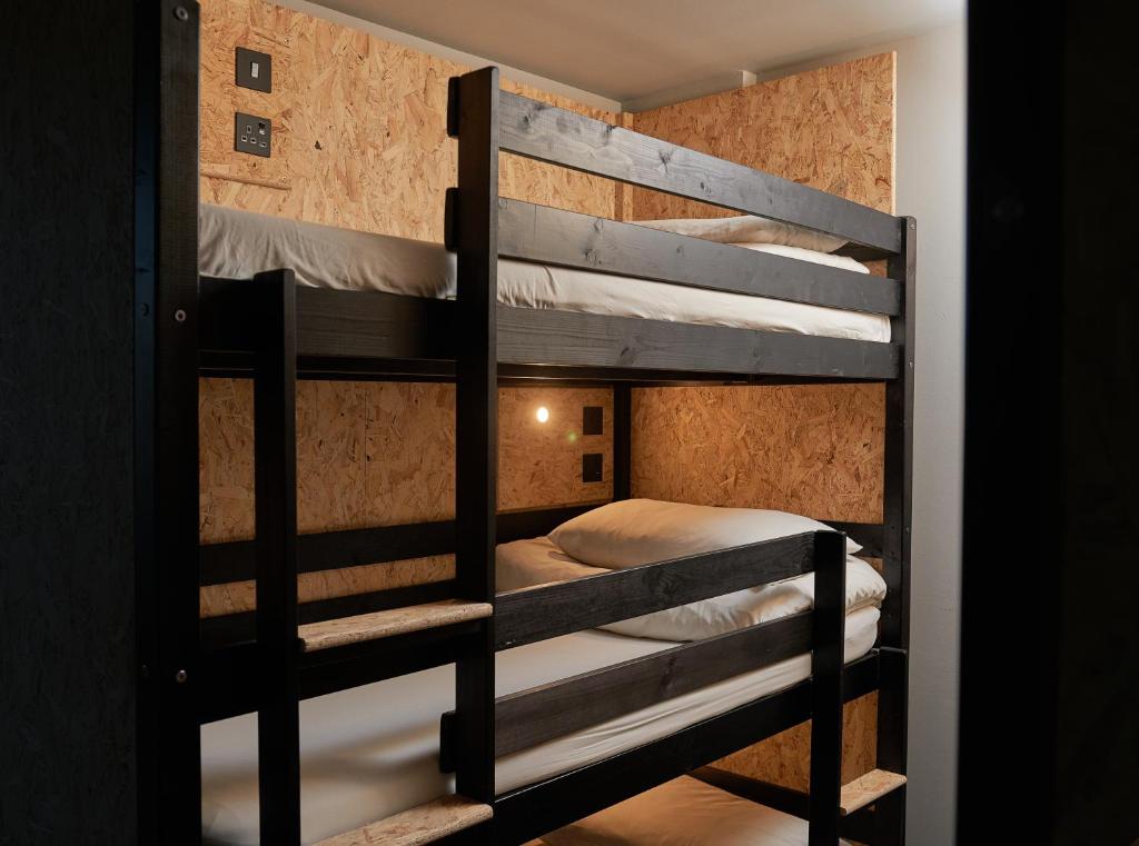 Postel nebo postele na pokoji v ubytování Haystack Hostel
