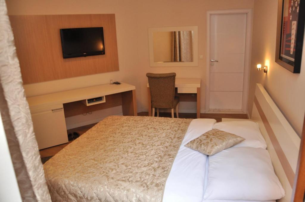 Postel nebo postele na pokoji v ubytování Hotel Prima