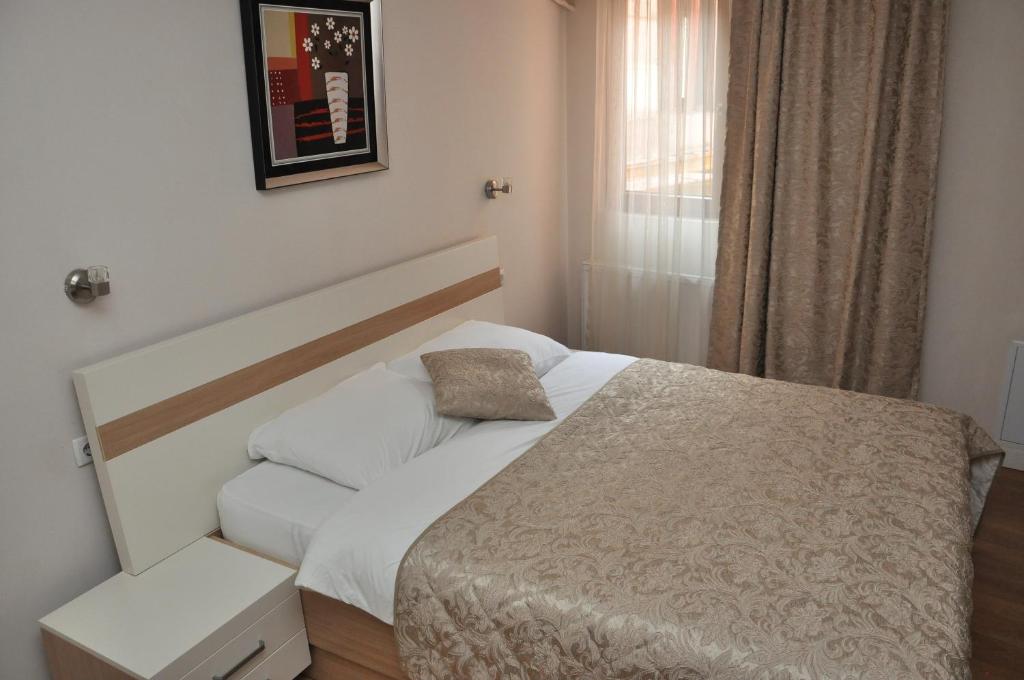 Postel nebo postele na pokoji v ubytování Hotel Prima