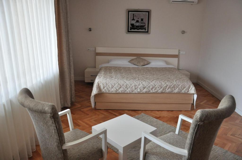 Postel nebo postele na pokoji v ubytování Hotel Prima