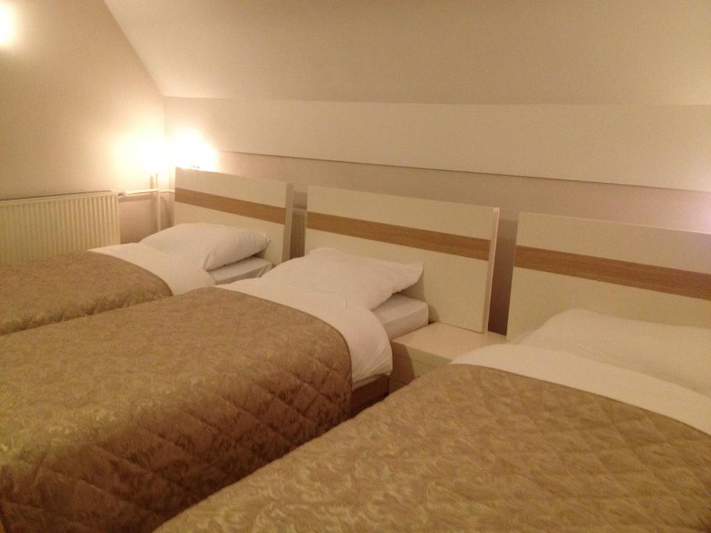 Postel nebo postele na pokoji v ubytování Hotel Prima