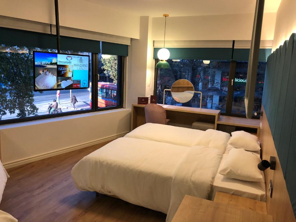 Ένα ή περισσότερα κρεβάτια σε δωμάτιο στο Mandrino Hotel
