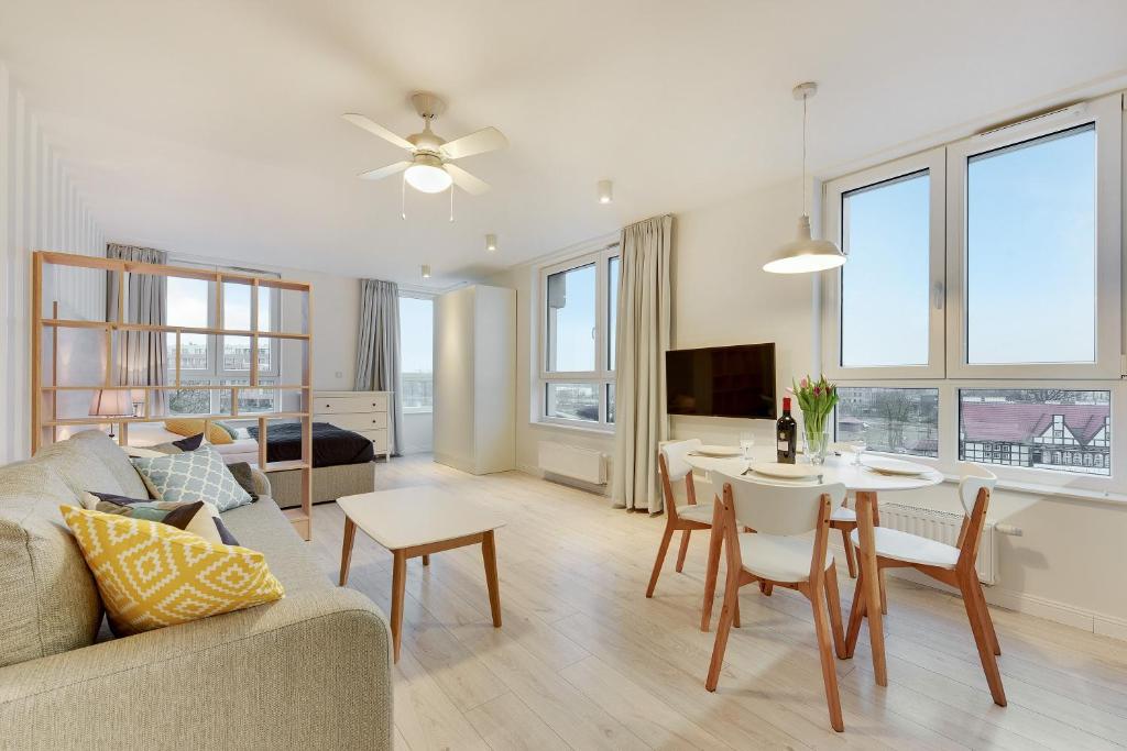 Televízia a/alebo spoločenská miestnosť v ubytovaní Chrobry Apartamenty Gdańsk Grodzka 10