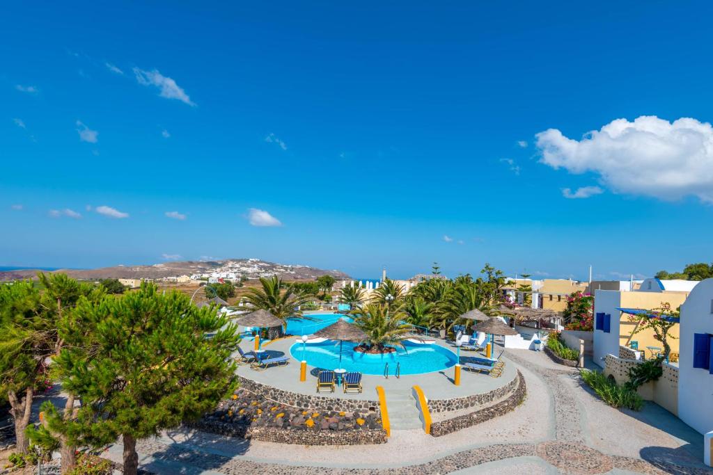 an aerial view of a resort with a swimming pool at Caldera View Resort - Adults Only in Akrotiri