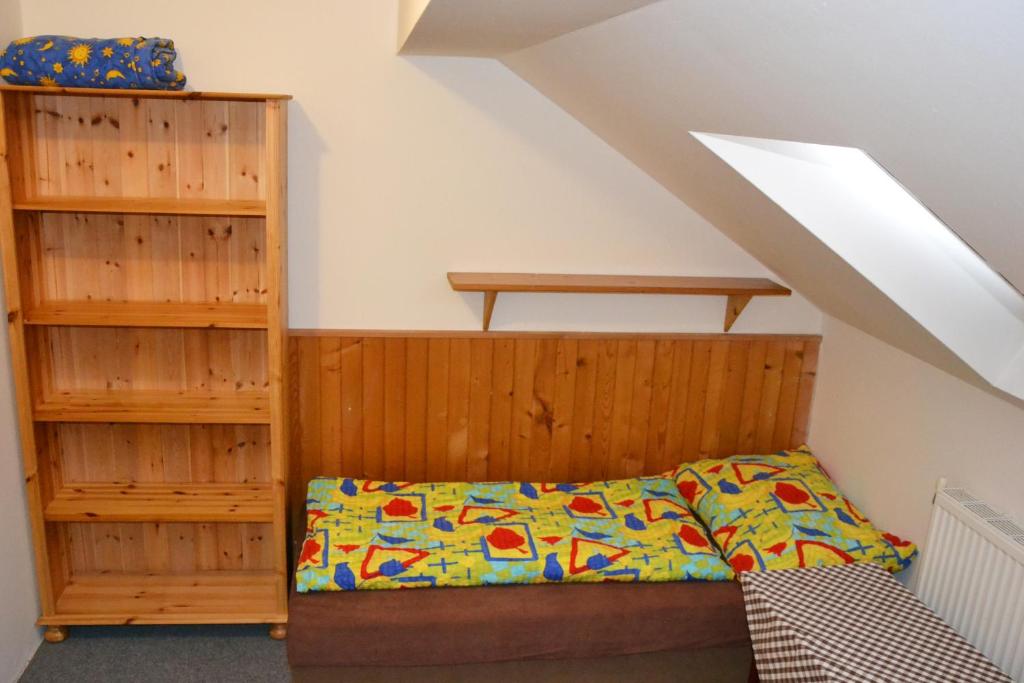 Postel nebo postele na pokoji v ubytování Penzion U Lípy