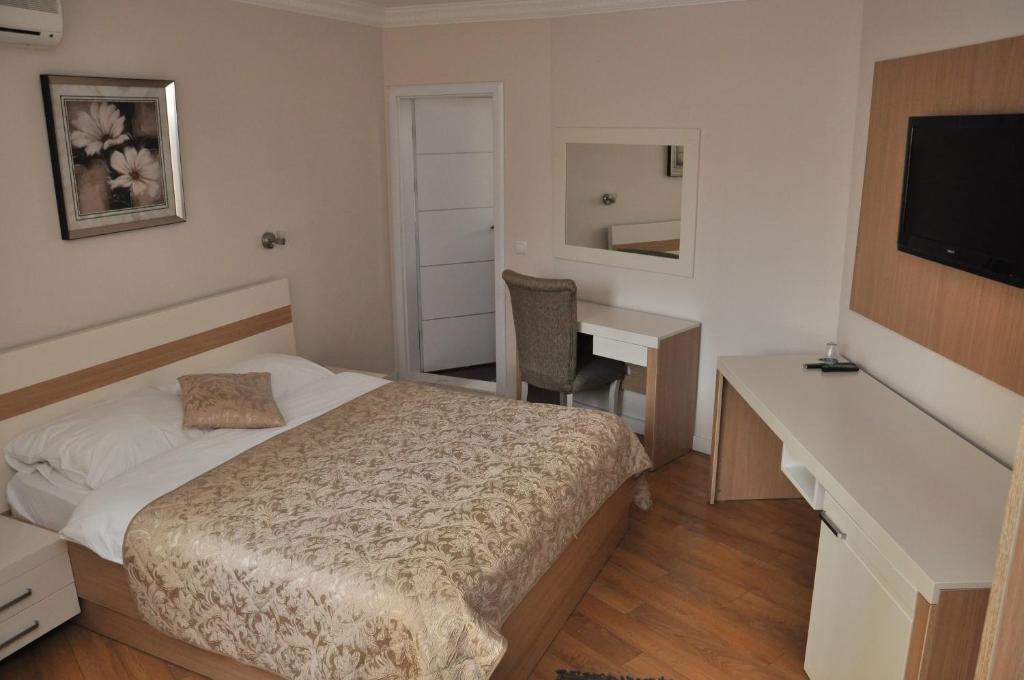 Postel nebo postele na pokoji v ubytování Hotel Prima