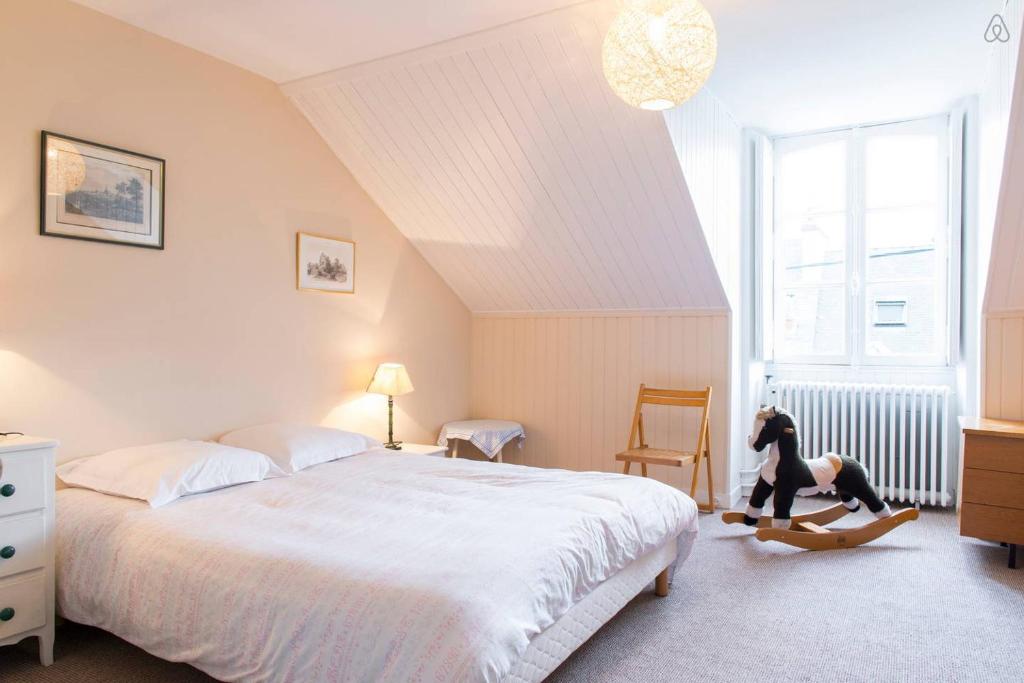 Ένα ή περισσότερα κρεβάτια σε δωμάτιο στο Chambres Saint Donatien