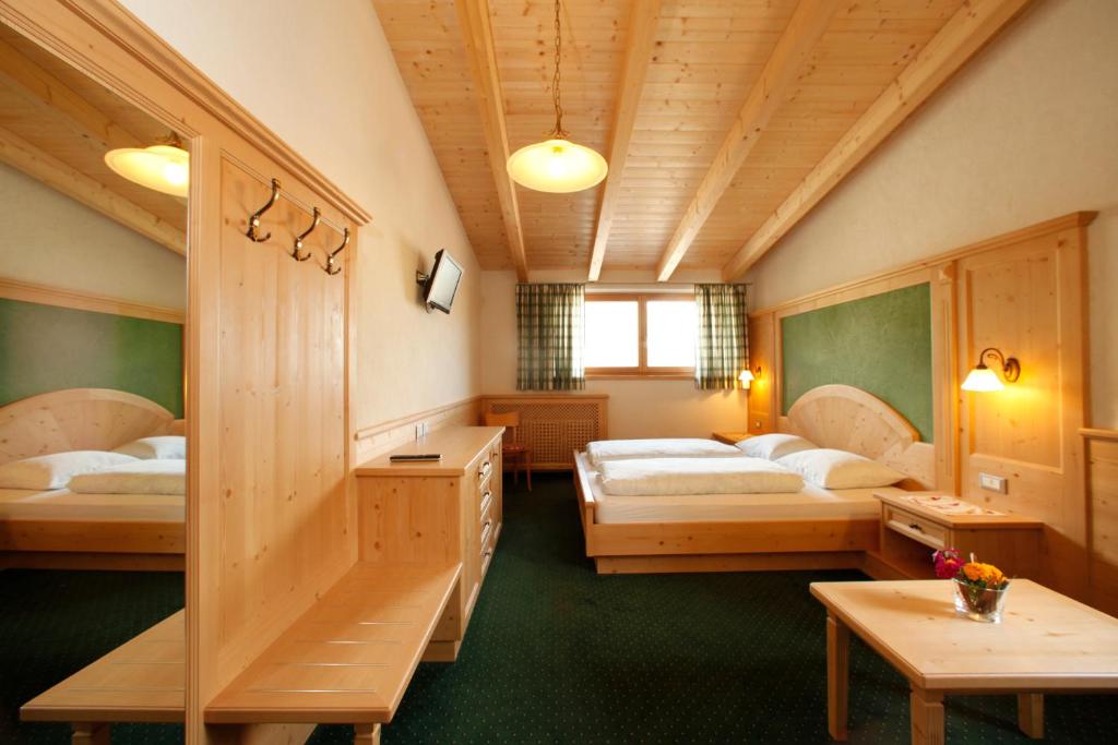Postel nebo postele na pokoji v ubytování Garnì Iosc