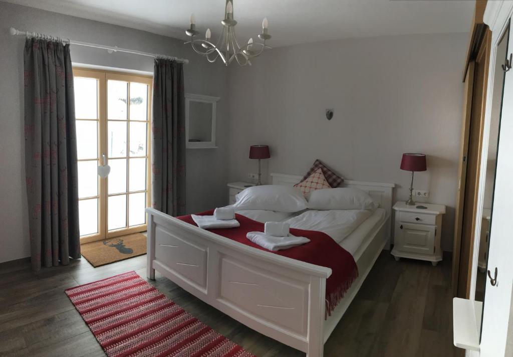 Postel nebo postele na pokoji v ubytování Platzhirsch