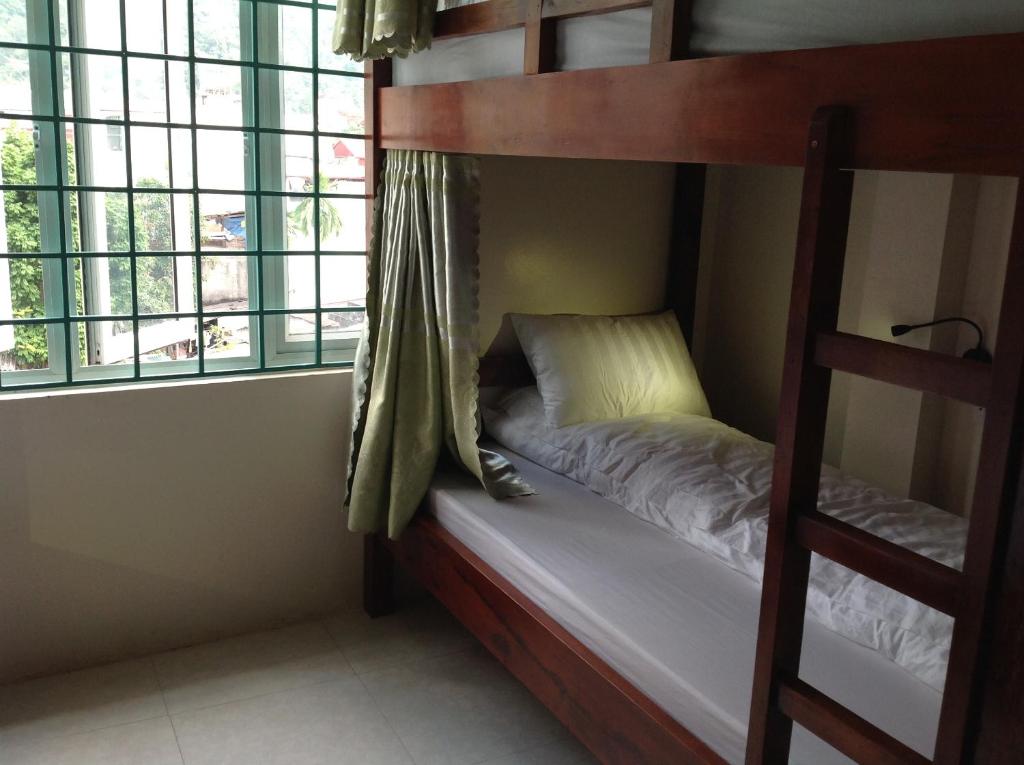 Postel nebo postele na pokoji v ubytování Ha Giang 1 Hostel and Loop Tour