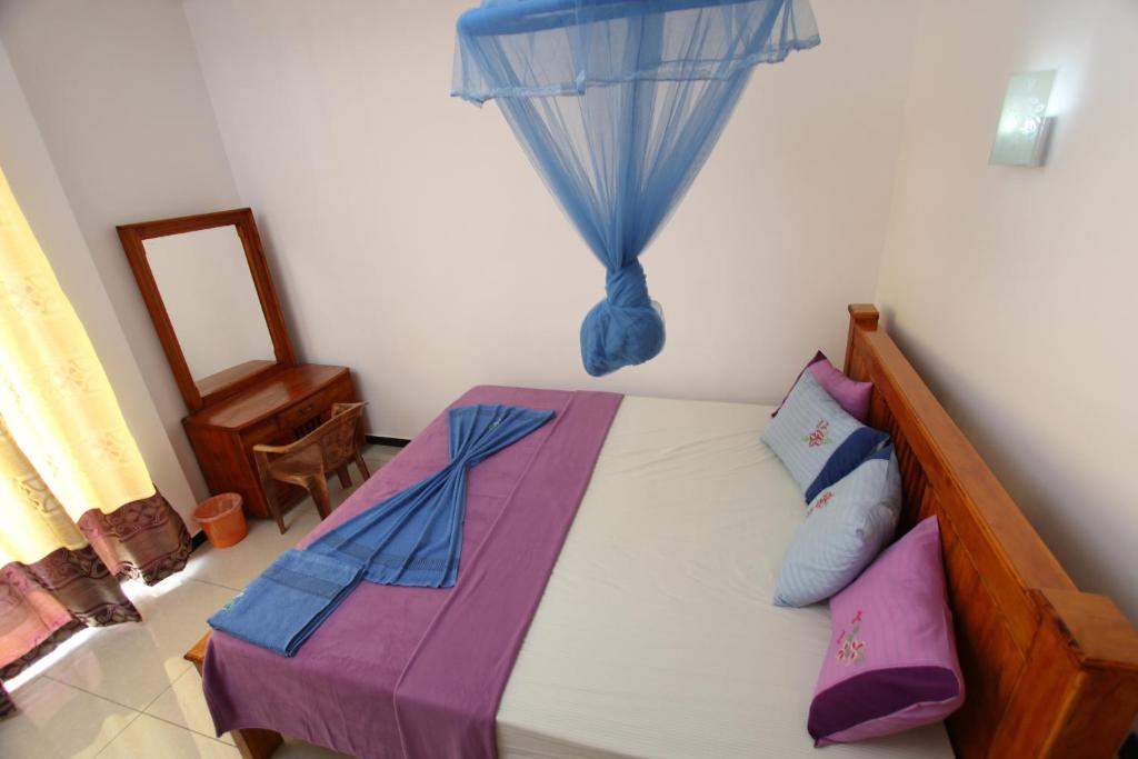 Postel nebo postele na pokoji v ubytování Sa Rest Inn