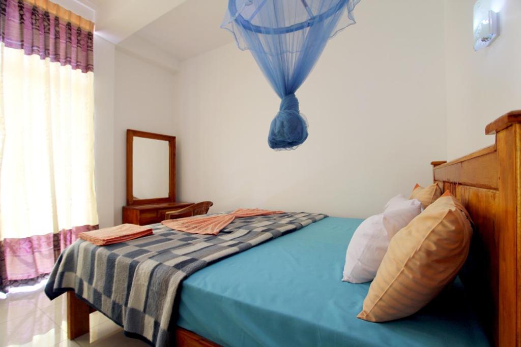 Postel nebo postele na pokoji v ubytování Sa Rest Inn