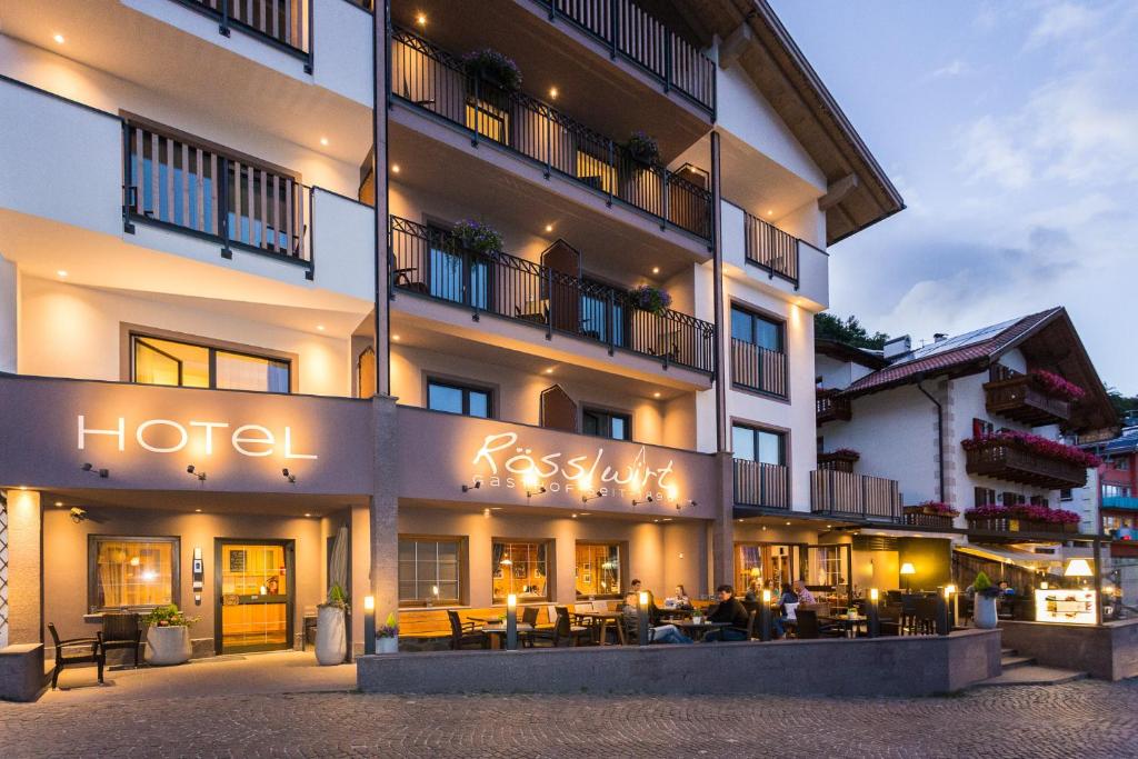 a hotel with a sign that reads russian hotel at R&ouml;sslwirt in Barbiano