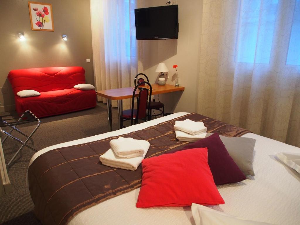 Postel nebo postele na pokoji v ubytování Hôtel de l'Aviation