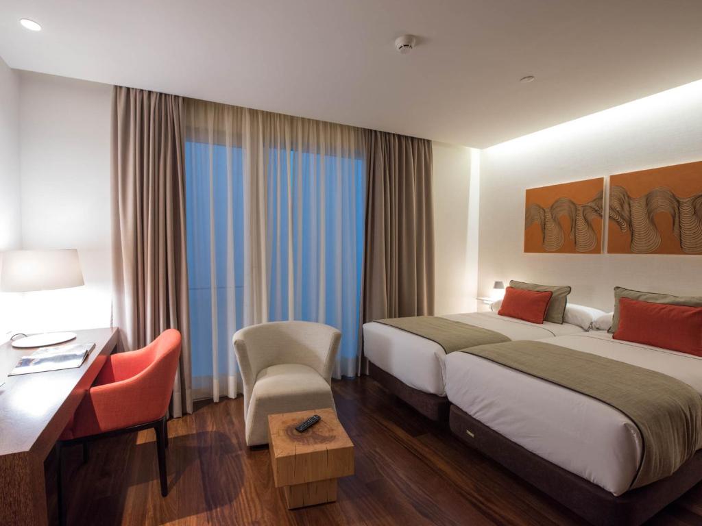 Postel nebo postele na pokoji v ubytování Hotel Carris Porto Ribeira