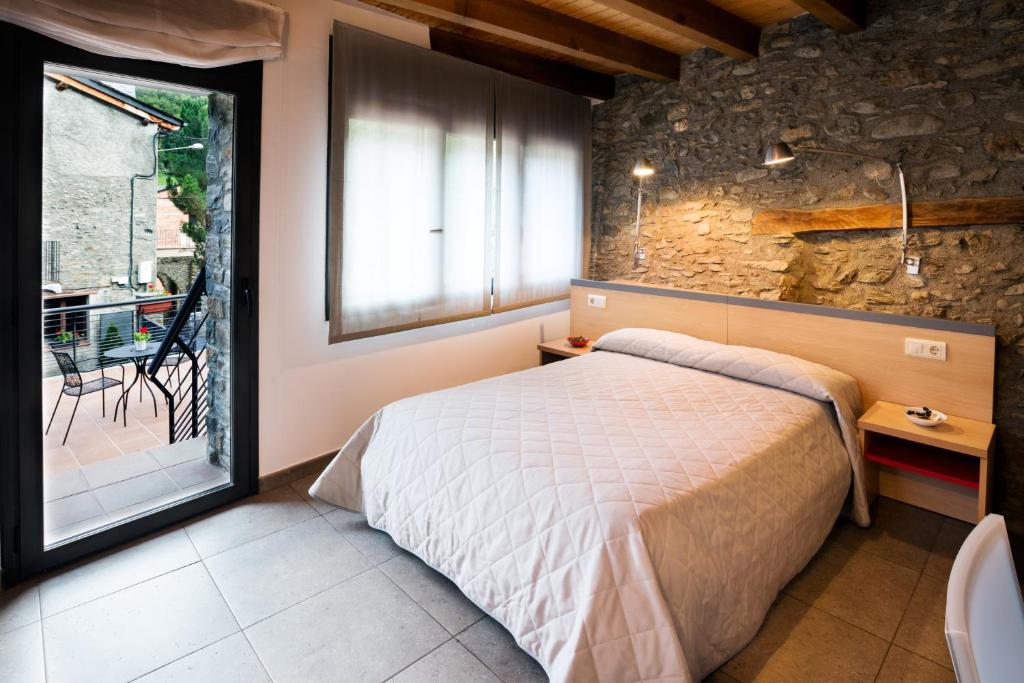Postel nebo postele na pokoji v ubytování Allotjament Rural Cal Miquel
