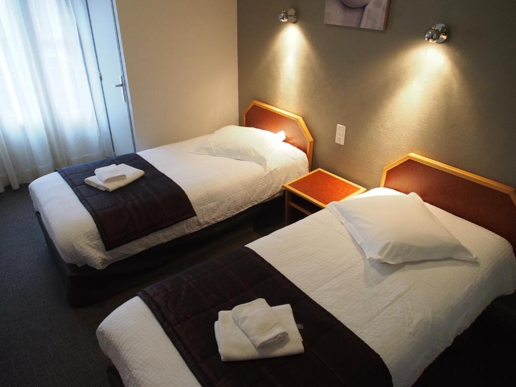 Postel nebo postele na pokoji v ubytování Hôtel de l'Aviation