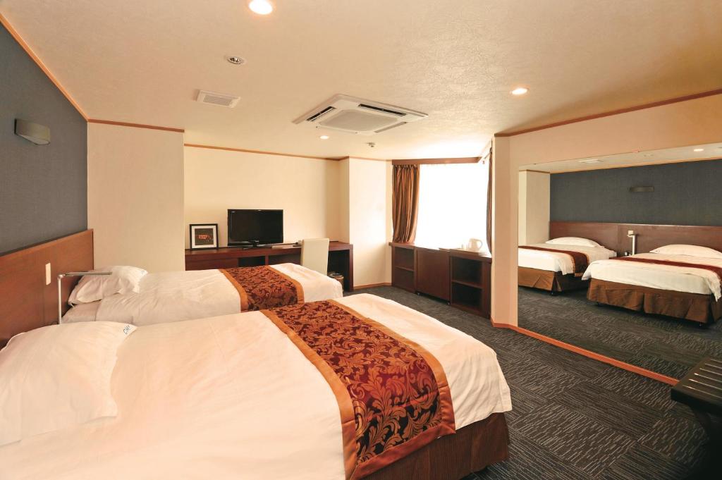Säng eller sängar i ett rum på Hotel Marine World