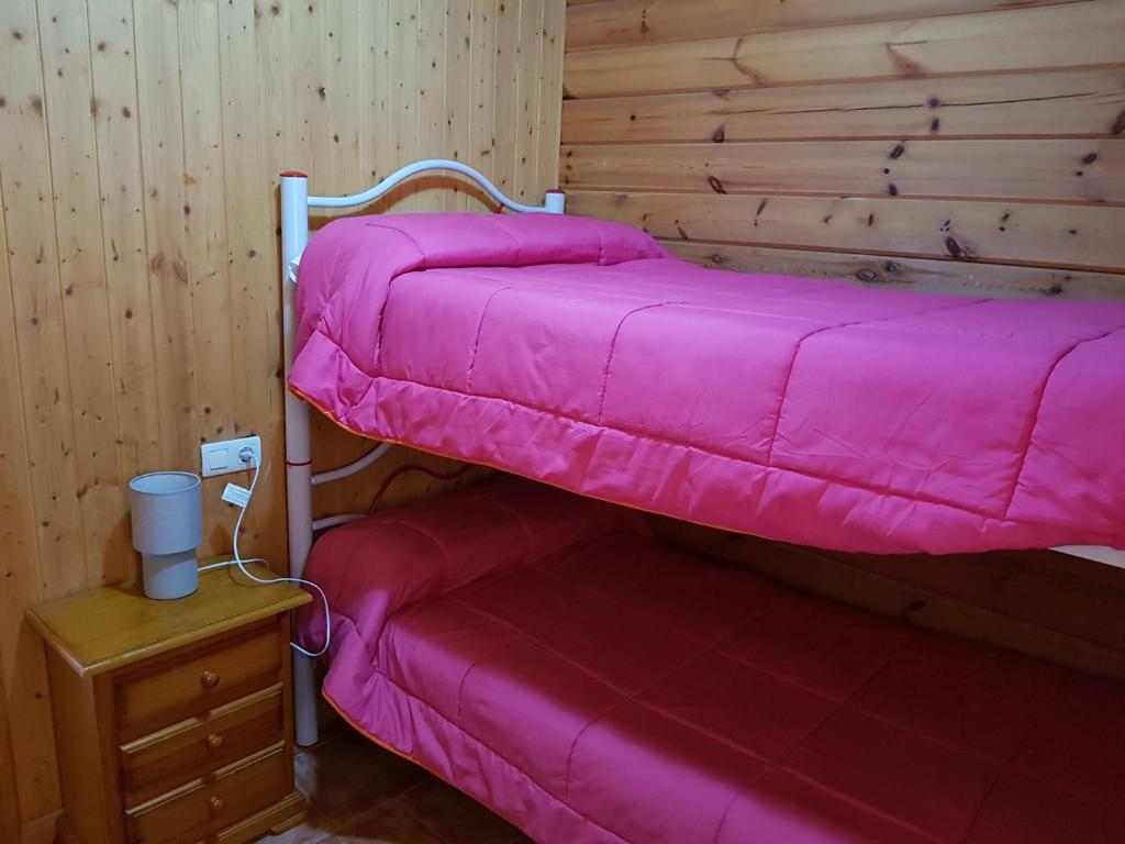 Cama o camas de una habitación en Camping Ruta del Purche