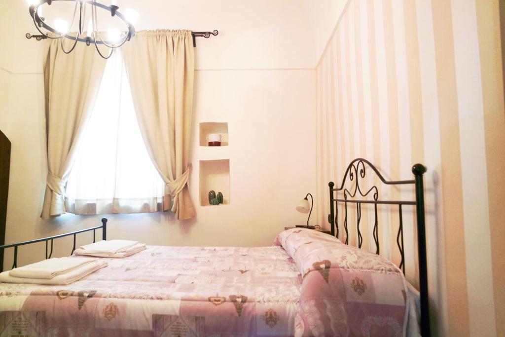Posteľ alebo postele v izbe v ubytovaní Al Vecchio Cellaio Historical Guest House