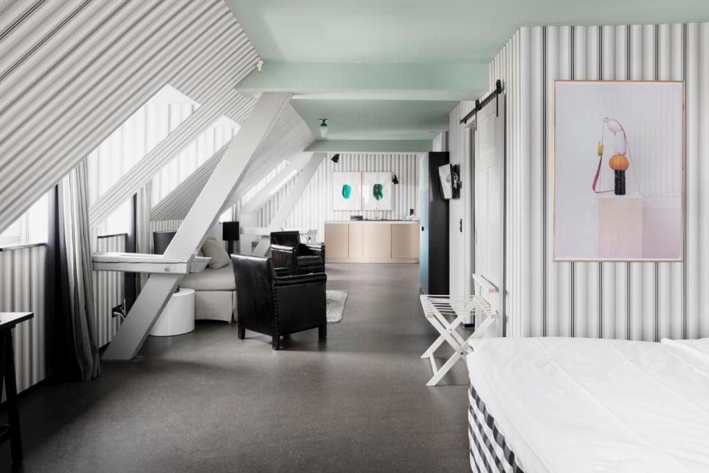 Postel nebo postele na pokoji v ubytování Boutique & Art Hotel Helvetia