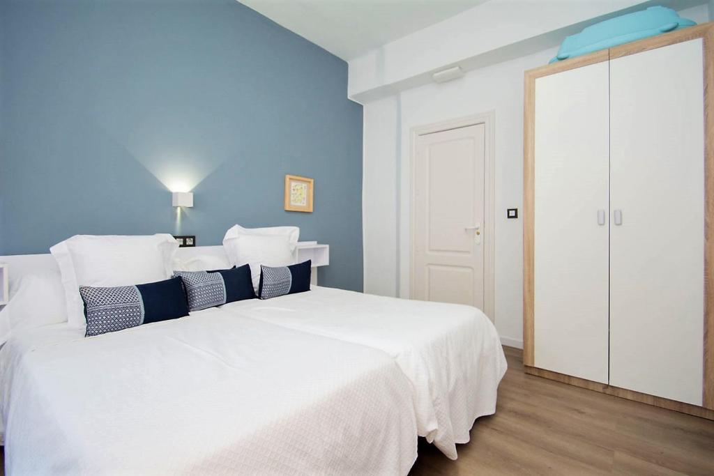 Posteľ alebo postele v izbe v ubytovaní Apartamento Recogidas 39