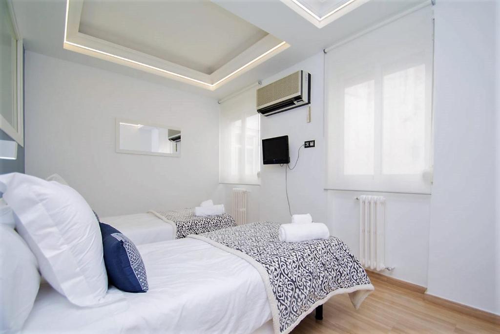 Posteľ alebo postele v izbe v ubytovaní Apartamento Recogidas 39