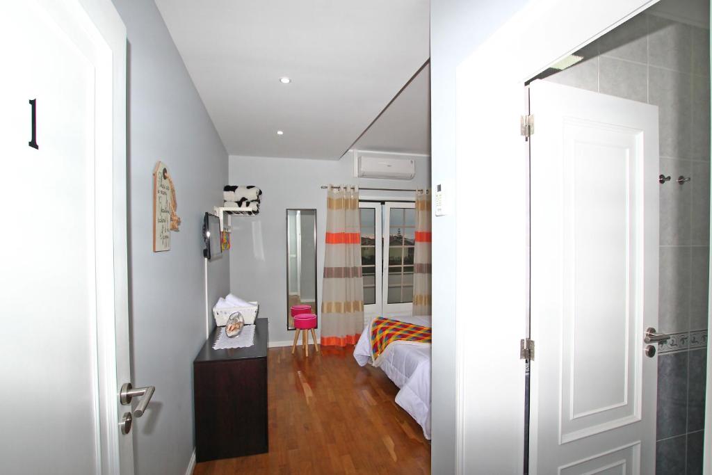 Postel nebo postele na pokoji v ubytování Guest House Pereira